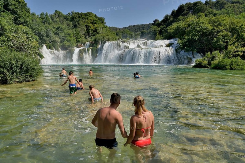 Tourists taking a bath at the Skradinski buk waterfalls, Krka National Park, Šibenik-Knin County, Dalmatia, Croatia, Europe