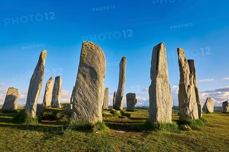Calanais Standing Stones central stone circle erected between 2900-2600BC measuring 11 metres wide. At the centre of the ring stands a huge monolith stone 4. 8 metres high weighing about 7 tonnes, which is perfectly orientated so that its widest sides