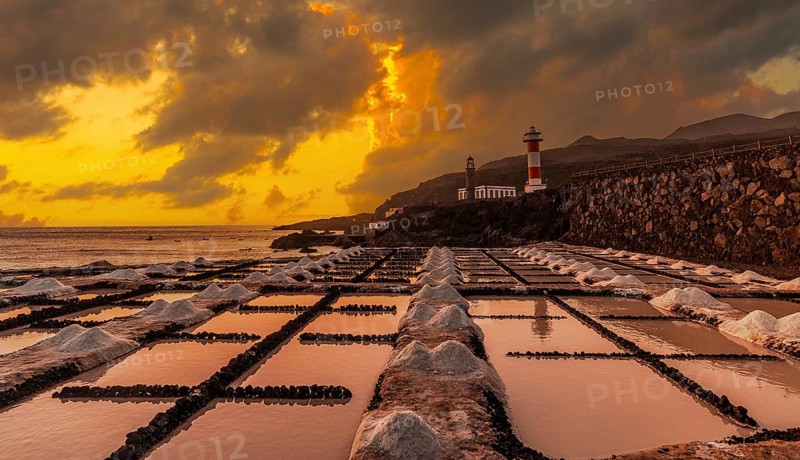Sunset at the Fuencaliente Lighthouse next to the salt flats, on the route of the volcanoes south of the island of La Palma, Canary Islands, Spain, Europe