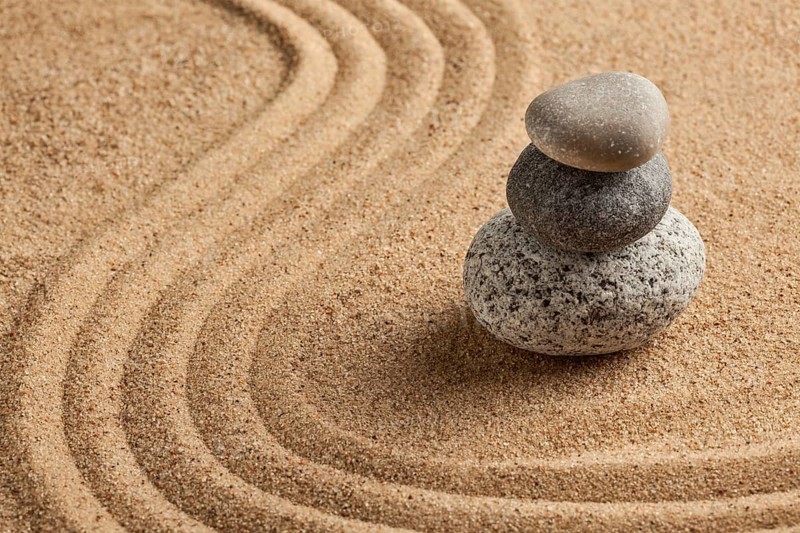 Japanese Zen stone garden, relaxation, meditation, simplicity and balance concept, pebbles and raked sand tranquil calm scene