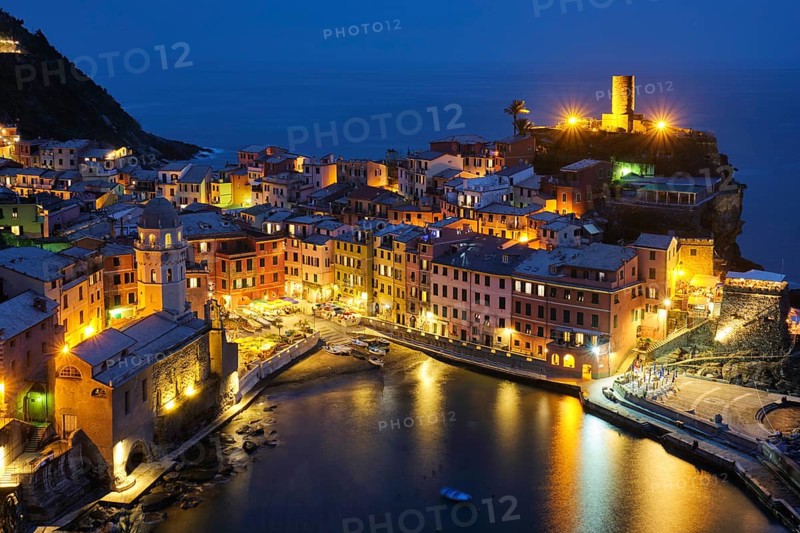 View of Vernazza village popular tourist destination in Cinque Terre National Park a UNESCO World Heritage Site, Liguria, Italy view illuminated in the night from Azure trail
