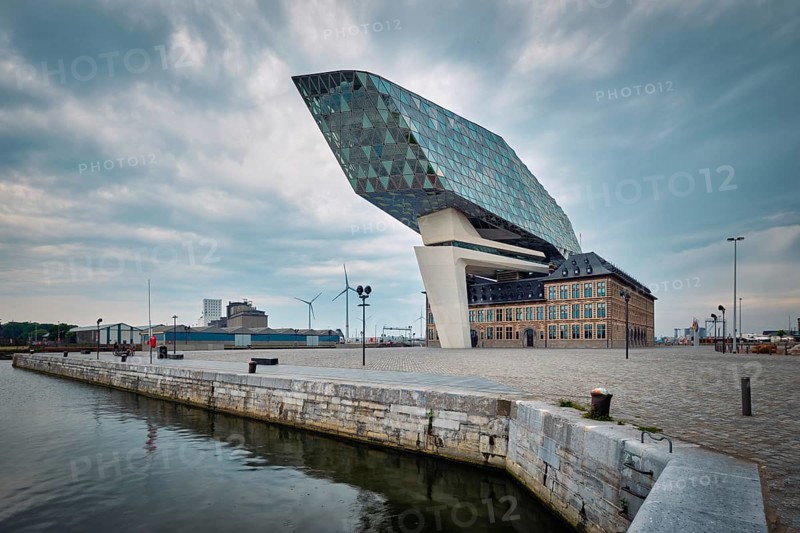 ANTWERP, BELGIUM, MAY 27, 2018: Antwerp port administration headquarters, designed by famous iranian architect Zaha Hadid, Antwerpen, Belgium which was her last project in stormy weather
