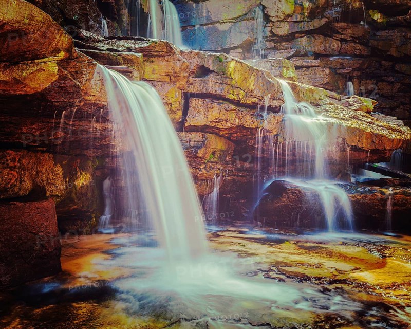 Vintage retro effect filtered hipster style image of tropical waterfall. Popokvil Waterfall, Bokor National Park, Cambodia, Asia