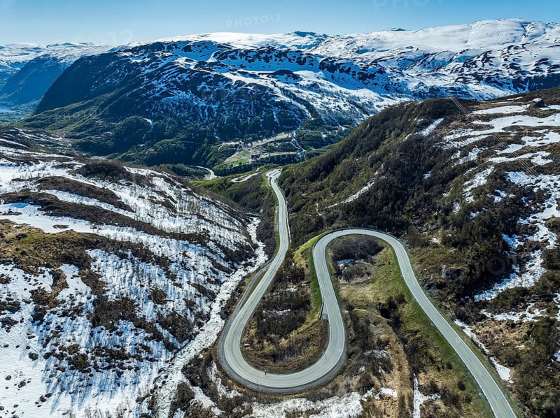 Aerial view of mountain road over the Haukelifjell, winding down to Roeldal, early spring, Norway, Europe