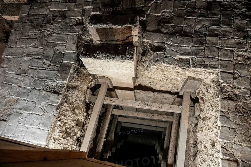 Wooden support structures inside a crumbling medieval stone passage at the royal palace of olite, navarre, spain, embodying history