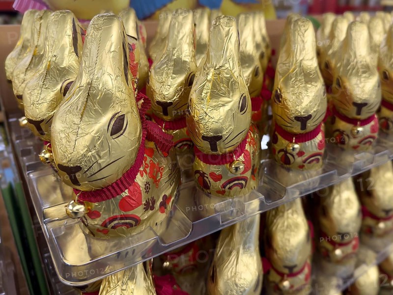 Display on retail shelf of wholesale chocolate Easter bunnies chocolate Easter bunnies chocolate Easter bunnies wrapped in gold-coloured tin foil, Germany, Europe