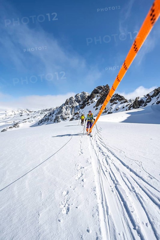 Ski tourer with rope, rope team on the Vadret da Porchabella glacier on the ascent to the summit of Piz Kesch, mountain landscape in winter, alpine tour, ski tour Bündner Haute Route, Albula Alps, Rhaetian Alps, Grisons, Eastern Switzerland, Switzerland, Europe