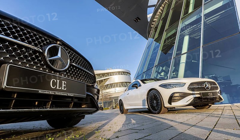 New Mercedes cars at the Stuttgart branch, with the Mercedes Museum behind it. Stuttgart, Baden-Württemberg, Germany, Europe