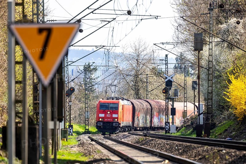 Goods train with a Deutsche Bahn AG locomotive travelling on the open track. Stuttgart, Baden-Württemberg, Germany, Europe