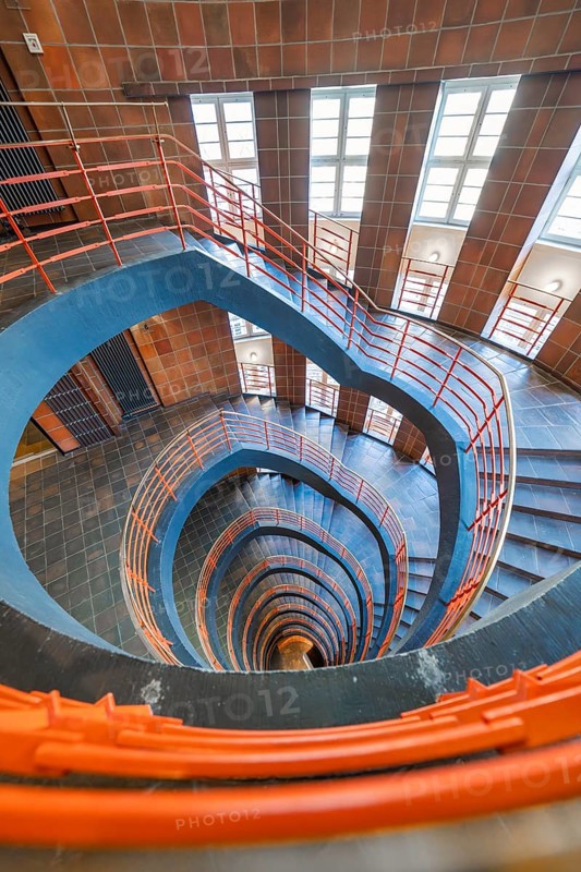 Wide-angle shot of a spiral staircase with red banisters, SPRINKENHOF, Hamburg, Germany, Europe