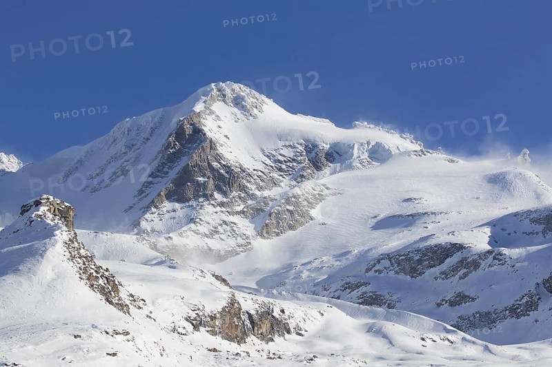 Snow covered mountaintop, pinnacle of the Gran Paradiso mountain in winter in the Gran Paradiso Massif of the Graian Alps, Aosta Valley, Italy, Europe