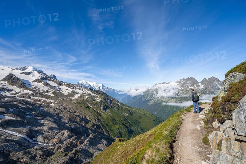 Mountaineer on a hiking trail, view into the valley with summit Mont Blanc, Chamonix, Haute-Savoie, France, Europe