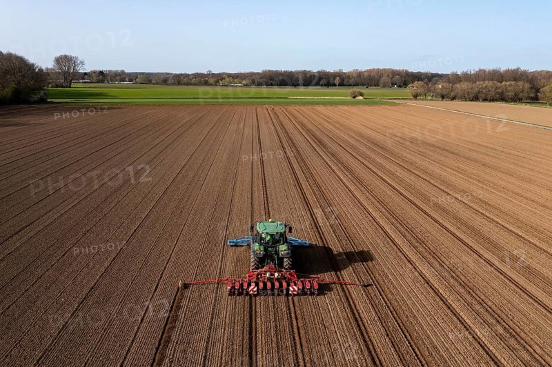 Sugar beet being sown in spring, precision sowing with precision seed drill, behind a tractor, Niederkrüchten, North Rhine-Westphalia, Germany, Europe
