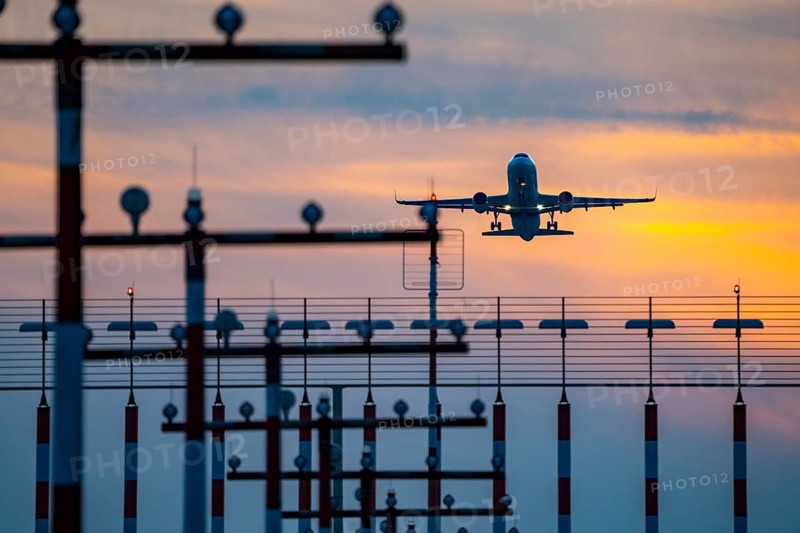 Runway lighting, approach aids, at Düsseldorf International Airport, sunset, aircraft taking off from the main runway south, 05R/23L, North Rhine-Westphalia, Germany, Europe