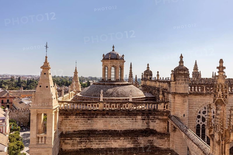 Gothic cathedral with towers and rich architecture in an urban setting, Seville