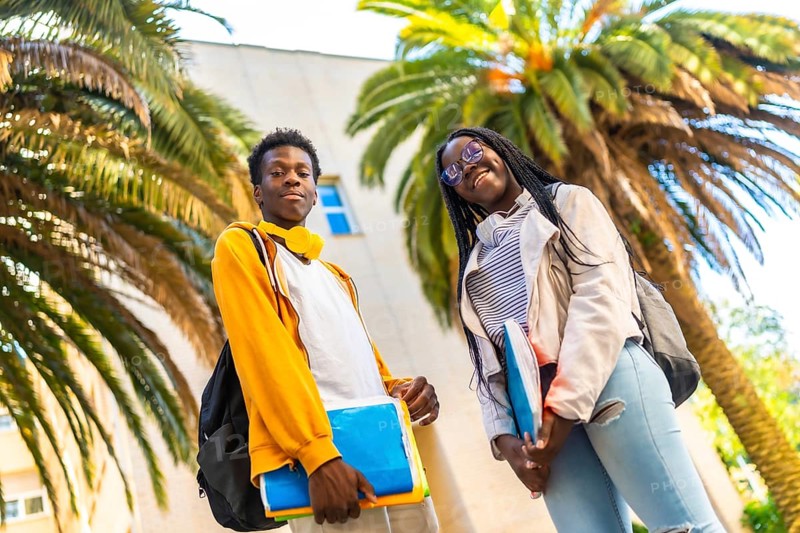 African american university students standing proud smiling at camera in the campus