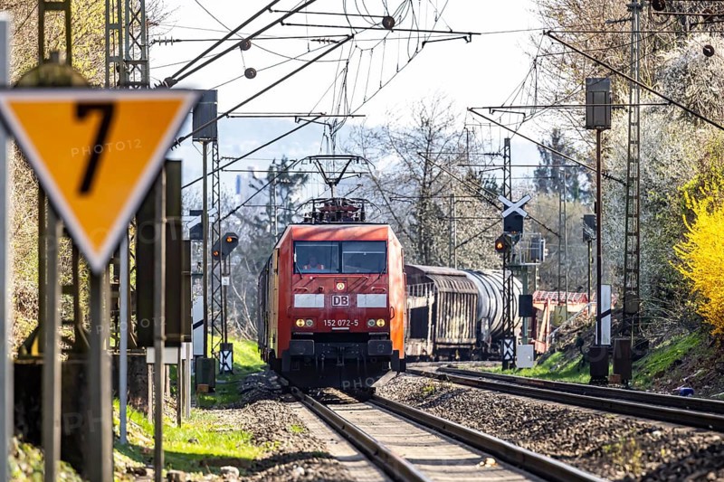 Goods train with a Deutsche Bahn AG locomotive travelling on the open track. Stuttgart, Baden-Württemberg, Germany, Europe