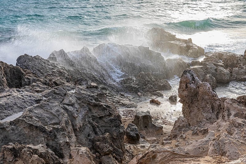 Sea water lashes over the eroded rocks on Salines beach, Ibiza, Balearic Islands, Mediterranean Sea, Spain, Europe