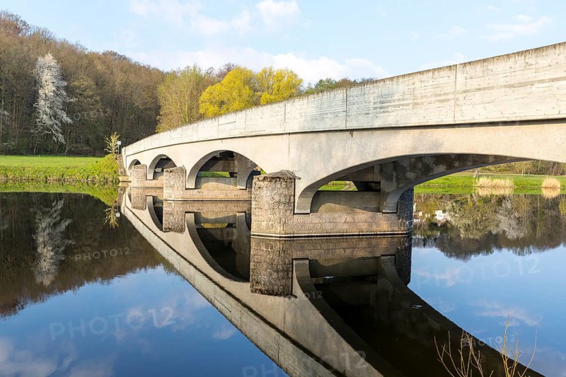 Arched bridge over the Freiberger Mulde with reflection in the water, Westewitz, district of Central Saxony, Germany, Europe