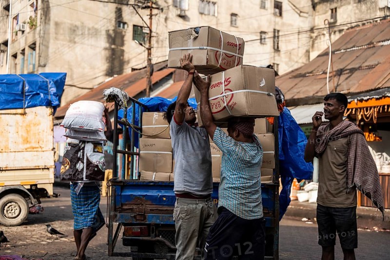 GUWAHATI, INDIA - MAY 1: Labourers carries goods in a wholesale market, in Guwahati, India, on May 1, 2025. May Day or Workers Day is a global holiday celebrated on May 1st to honor workers and their contributions, Asia