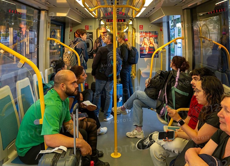 People on metro tram train public transport system, city of Porto, Portugal, Europe