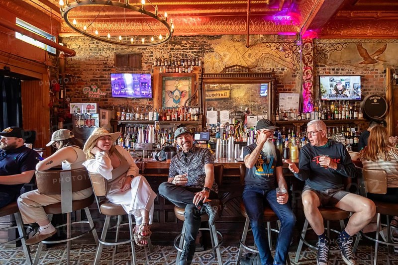 New Orleans, Louisiana - People at the bar drink and listen to music at Bamboula's music club on Frenchmen Street in the Marigny neighborhood