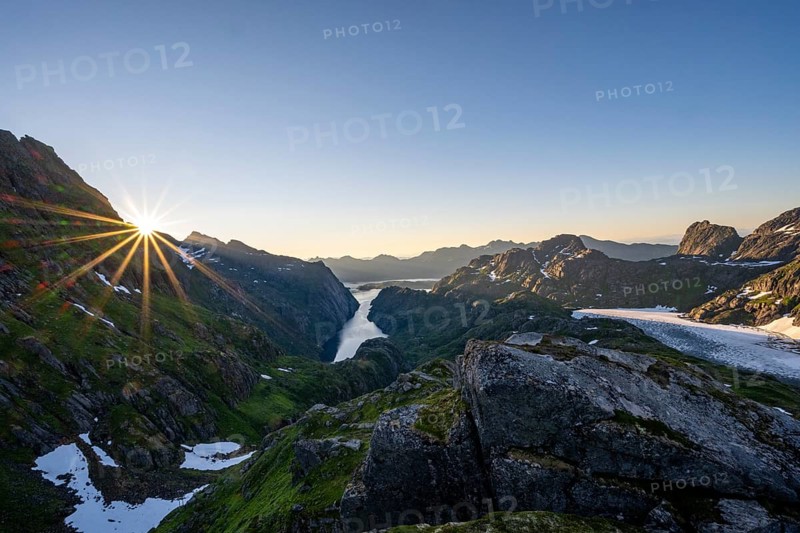 Picturesque mountain landscape at sunrise with sun star, fjord Trollfjord and Raftsund, hike to Trollfjord Hytta, Lofoten, Nordland, Norway, Europe