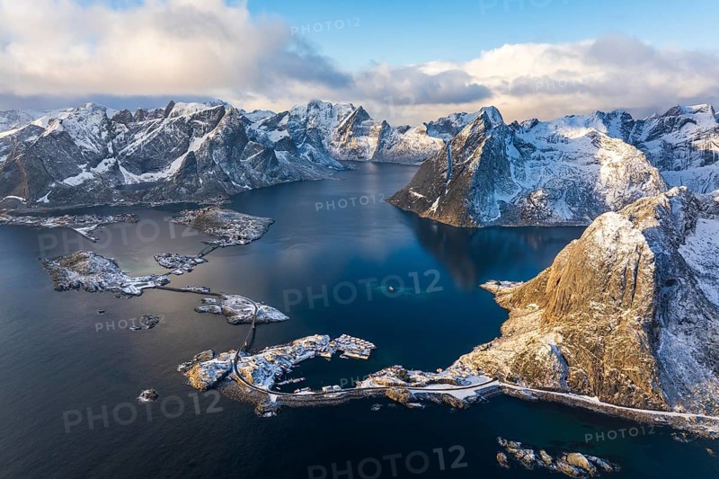 View of islands, fjord and mountains, snow-covered landscapeFishing villages Hamnøy, Sakrisøy and Reine, Reinefjord, Lofoten, Norway, Europe