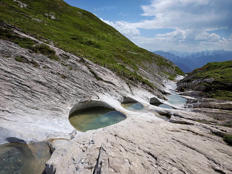 Glacier mill with glacier pots on the Trinser Alp Mora, Trin, Canton Graubünden, Switzerland, Europe