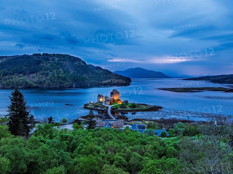 Night over Eilean Donan Castle and Loch Duich from a drone, Isle of Skye, Highlands, Scotland, England, United Kingdom, Europe