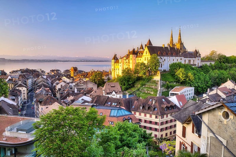 Neuchâtel Castle with view over the town of Neuchâtel at sunrise, behind it Lake Neuchâtel, Canton of Neuchâtel, Switzerland, Europe