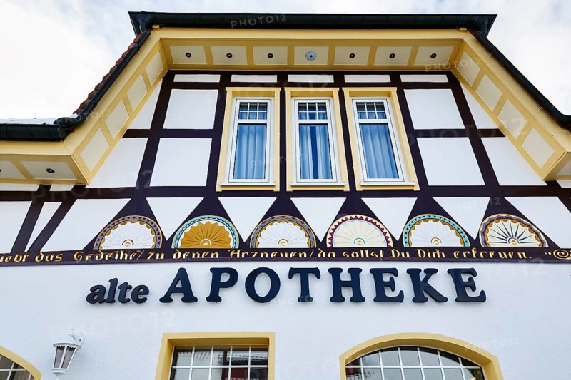 Old pharmacy, facade detail, historic headquarters of the Schierker Feuerstein brand in Schierke, Wernigerode, Harz National Park, Saxony-Anhalt, Germany, Europe
