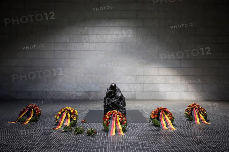 The wreaths of all five permanent constitutional bodies lie in front of the sculpture Mother with dead son by Käthe Kollwitz after the silent commemoration of the 80th anniversary of the end of the Second World War in the Neue Wache, the central memorial of the Federal Republic of Germany for the victims of war and tyranny, Berlin, 8 May 2025