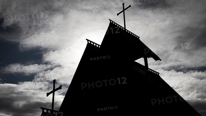 The silhouette of a church with several crosses against a cloudy sky, backdrop Kristin Lavranstochter film, Jørundgard Middelaldersenter, Olavsweg or Olavsleden, Sel municipality, Gudbrandsdalen, Norway, Europe