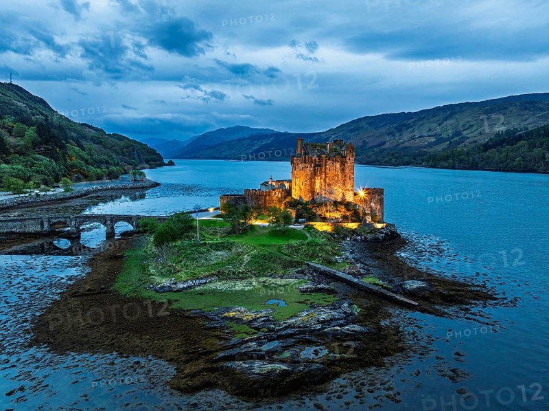 Night over Eilean Donan Castle and Loch Duich from a drone, Isle of Skye, Highlands, Scotland, England, United Kingdom, Europe