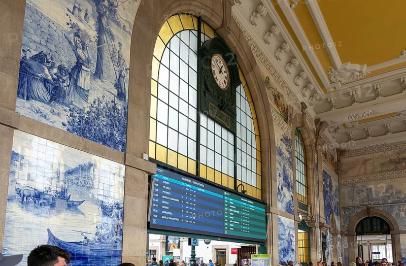 Azulejos tiles and clock interior Sao Bento railway station building, city of Porto, Portugal, Europe