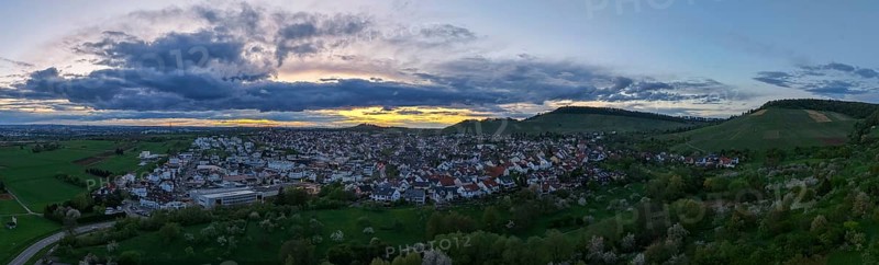 Urban panorama at dusk with dense clouds and rolling hills in the distance, Korb-Steinreinach, Rems Valley, Baden-Württemberg, Germany, Europe