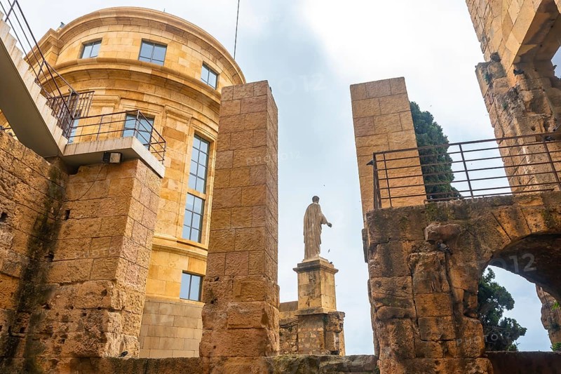 Roman statue standing tall amidst the ruins of tarragona, showcasing the city's rich historical heritage