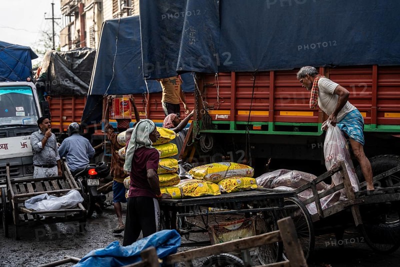 GUWAHATI, INDIA - MAY 1: Labourers carries goods in a wholesale market, in Guwahati, India, on May 1, 2025. May Day or Workers Day is a global holiday celebrated on May 1st to honor workers and their contributions, Asia