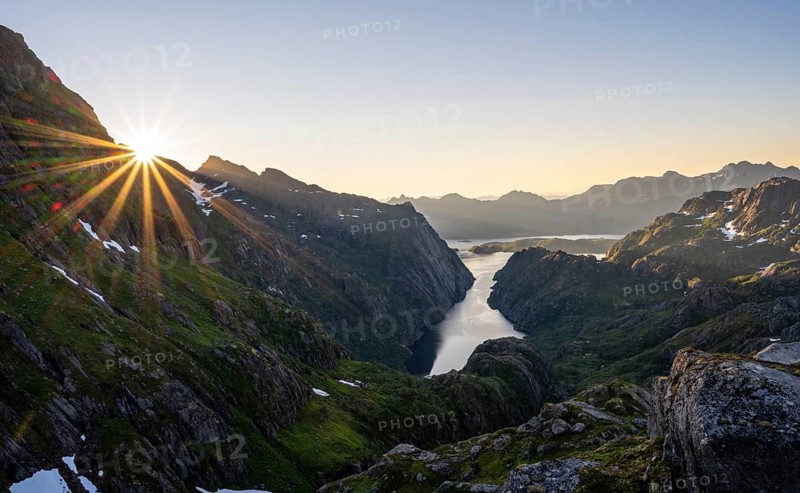 Picturesque mountain landscape at sunrise with sun star, fjord Trollfjord and Raftsund, hike to Trollfjord Hytta, Lofoten, Nordland, Norway, Europe
