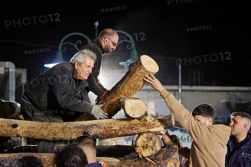 Men working together at night to build a large pile of wood for a fire, Easter fire Psinthos, Holy Saturday, Easter, Psinthos, Rhodes, Dodecanese, Greek Islands, Greece, Europe