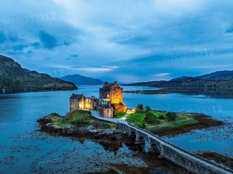 Night over Eilean Donan Castle and Loch Duich from a drone, Isle of Skye, Highlands, Scotland, England, United Kingdom, Europe
