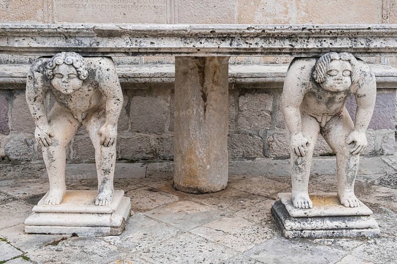 Table supported by stone sculptures, Island of Mary of the Rock, Gospa od Skrpjela, World Natural and Cultural Heritage Site, Bay of Kotor, Adriatic Sea, Mediterranean, Montenegro, Balkans, Europe