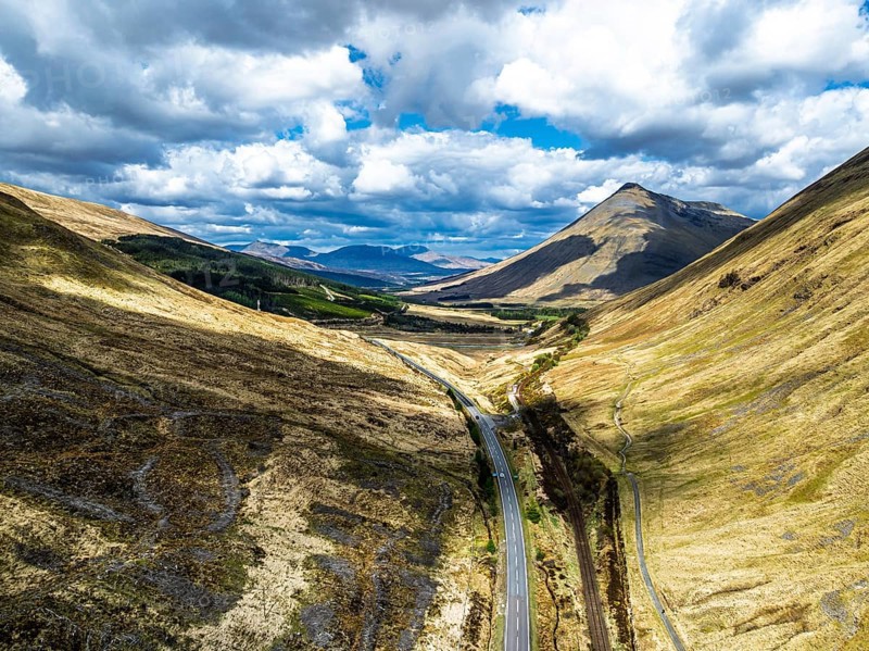 Montaims over West Highland Way A82 from a drone, Clifton, Crianlarich, Highland, Scotland, UK