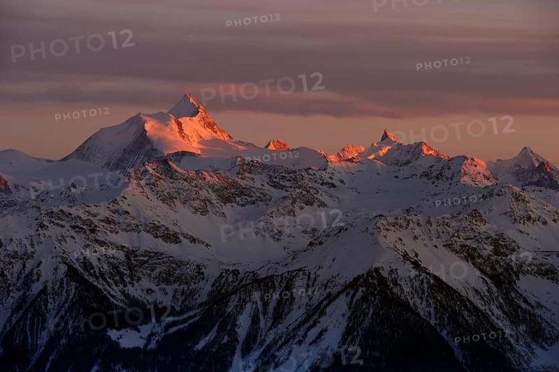 Sunset with Alpine glow over snow coverd mountains, Valais Alps, Switzerland, Europe