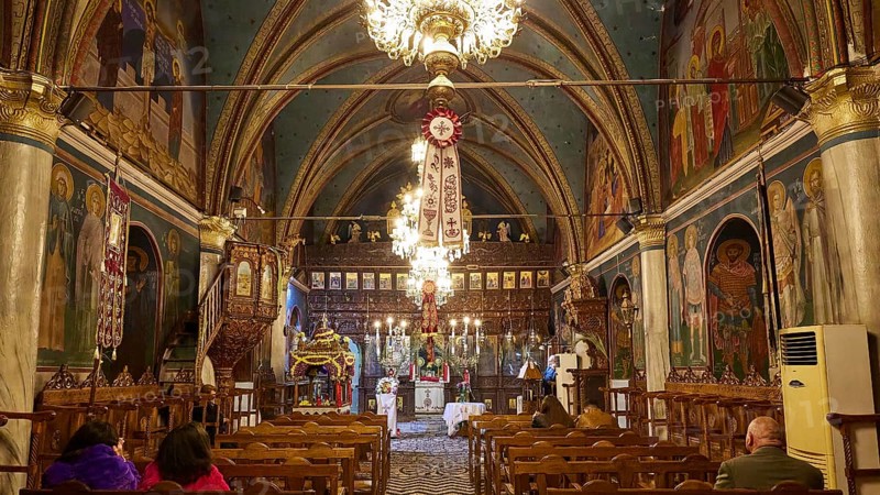 Interior of a church with paintings and chandeliers, people sitting in the pews, Easter fire Psinthos, Holy Saturday, Easter, Psinthos, Rhodes, Dodecanese, Greek Islands, Greece, Europe