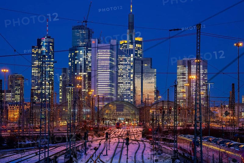 Railway tracks in front of the main railway station in Frankfurt am Main, skyline of skyscrapers in the Cit, winter, snow, dusk, Hesse, North Rhine-Westphalia
