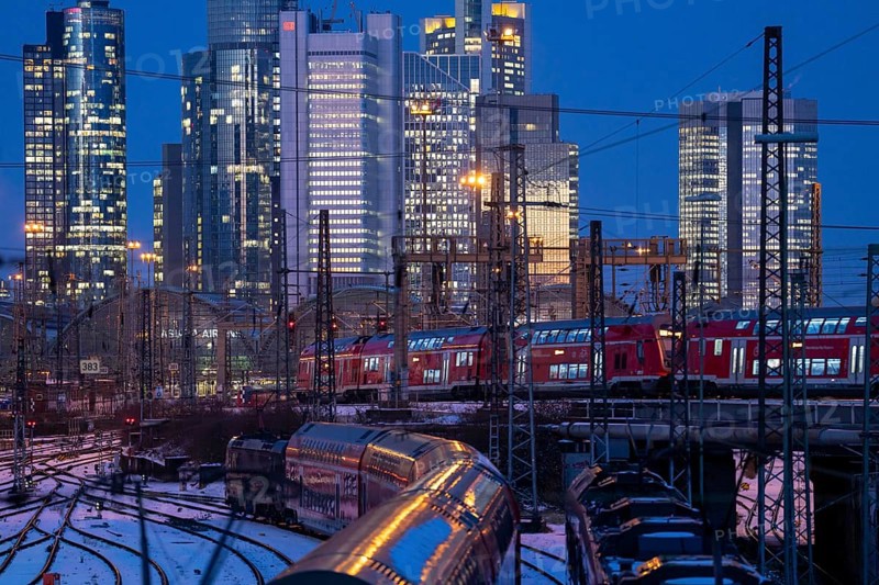 Railway tracks in front of the main railway station in Frankfurt am Main, skyline of skyscrapers in the Cit, winter, snow, dusk, Hesse, North Rhine-Westphalia
