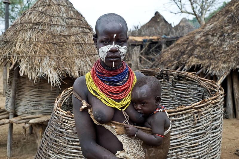Portrait of a young mother and child from the Karo tribe, Omo valley, Ethiopia, Africa
