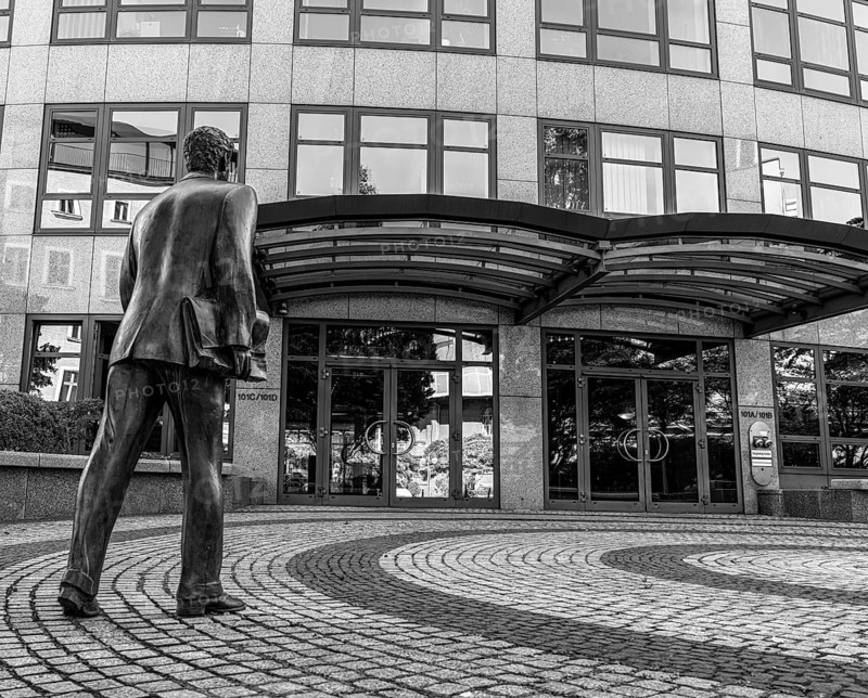 Black and white photograph, male bronze figure, depiction of administrative official with briefcase, Entrance 101, Spreebogen Berlin-Moabit, Berlin, Germany, Europe